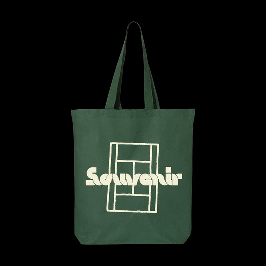 A dark green 100% cotton tote bag with two handles, featuring a bold white graphic and the word Souvenir on the front—an economical tote from the brand Souvenir.