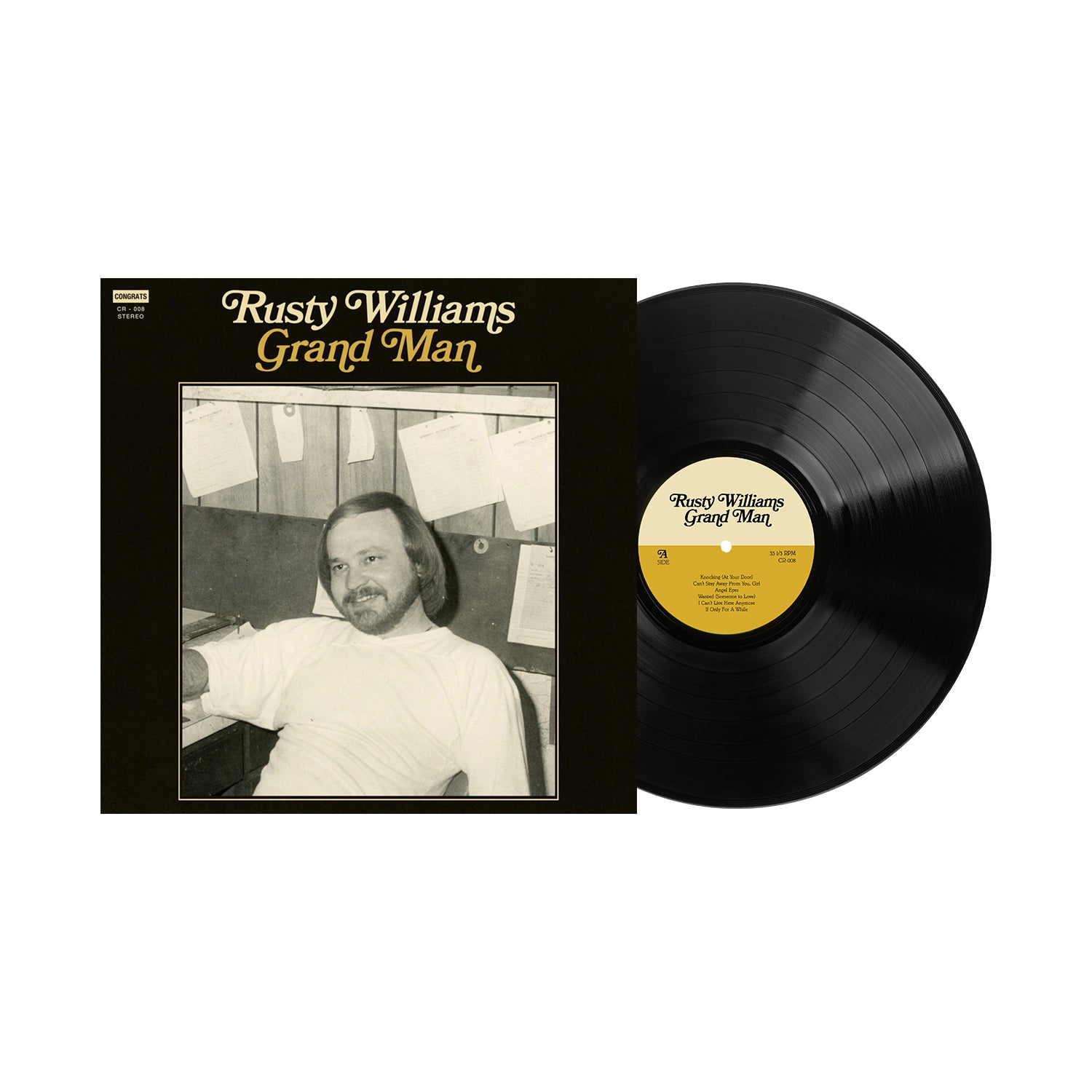 The Rusty Williams vinyl record, titled Grand Man, features a smiling bearded man on the album cover, sitting at a desk with papers on the wall behind him. Now shipping, this release includes a detailed track listing for fans. Brand: Rusty Williams.