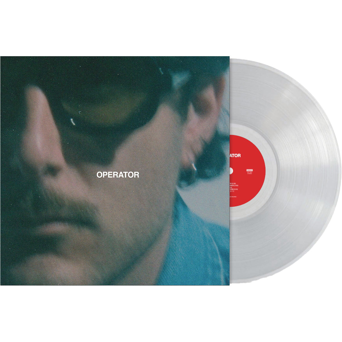 A clear vinyl record by Zac Farro is partially pulled from its sleeve. The album cover features a blurry close-up of someone in sunglasses, with OPERATOR in white text at the center, evoking Gold Days and Second Chance vibes.