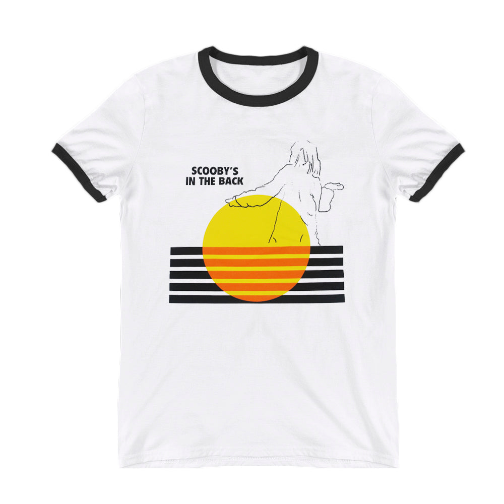 image of a white and black ringer tee shirt on a white background. tee has full center chest print of a yellow circle with five black bars across. an outline sketch of the back of a person. at the top left says scooby's in the back