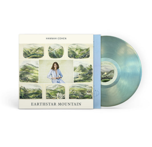 The Hannah Cohen Earthstar Mountain vinyl album features a dusty landscape and artist portrait on the cover, with a translucent pale aqua record partly visible, highlighting the album's unique track list.