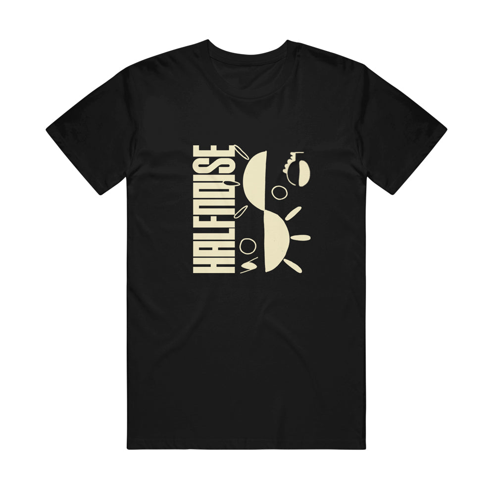 image of a black tee shirt on a white backgound. tee has center chest print in creme that says halfnoise vertically on the left and then a sun cut in two parts stacked on the right