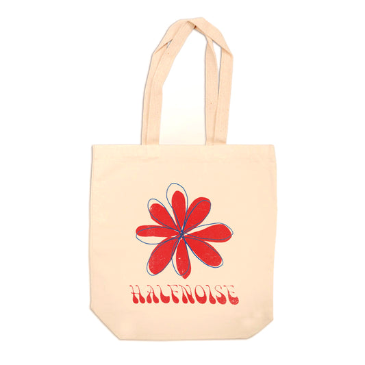 image of a natural colored tote back on a white background. tote has full print in red of a hand drawn flower and at the bottom says halfnoise